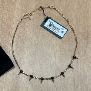 All Saints Gold Necklace with Black Accents
